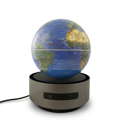 A photorealistic studio photo of the Replogle levitating blue ocean desk globe, angled to show the left side, centered on a pure white background with a natural shadow.